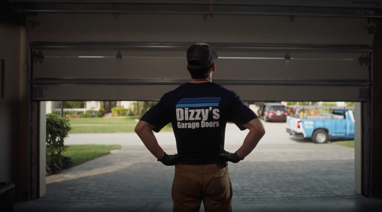 Garage door technician working on a residential overhead door